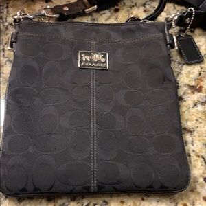 Coach brand-Black/black monogram Crossbody bag.
